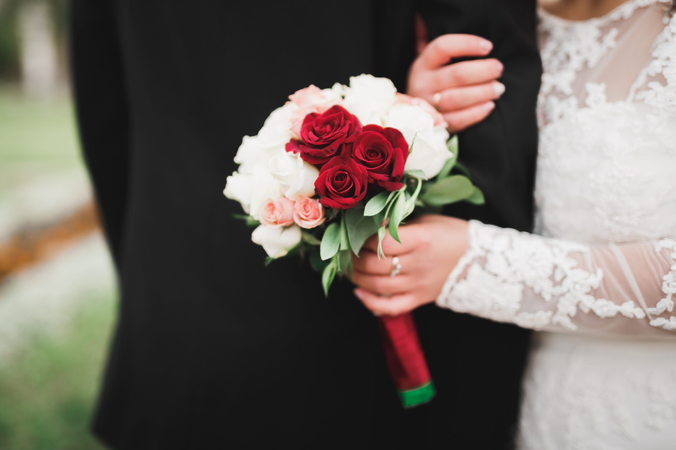 Bride holding big and beautiful wedding bouquet with flowers